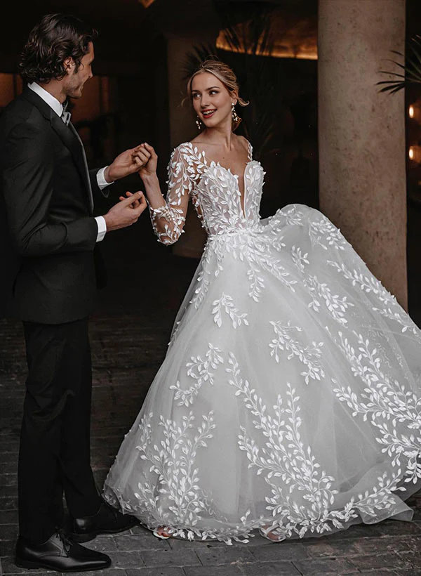 Model wearing an elegant A-line V-neck floor length wedding dress.