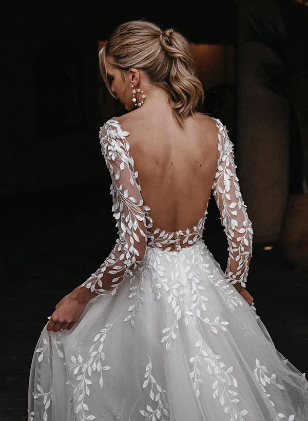 Back view of the flowing A-line floor length wedding dress.