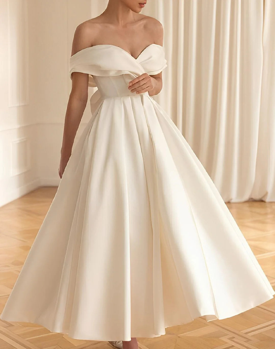 Woman wearing an elegant A-line V-neck floor-length wedding dress.