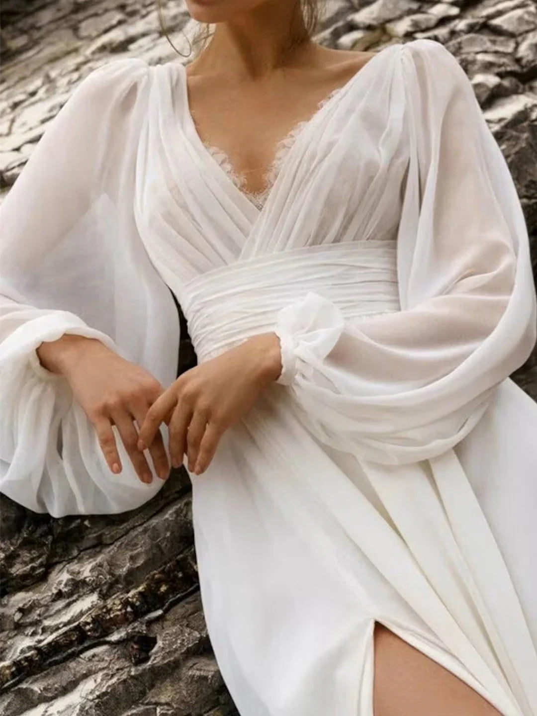 Side view of the elegant A-Line floor-length bridal gown.