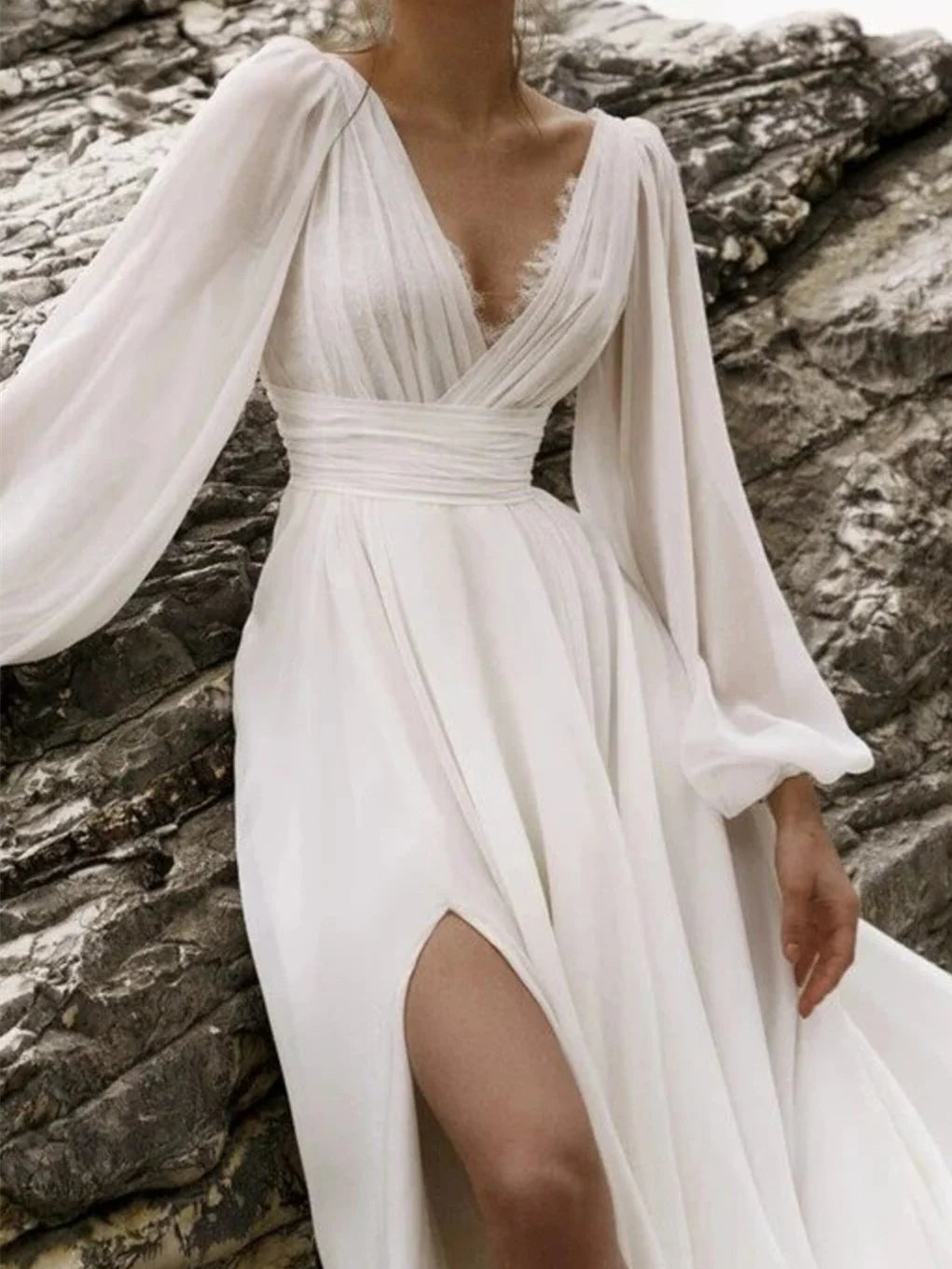 Model wearing an elegant A-Line V-Neck floor-length wedding dress.