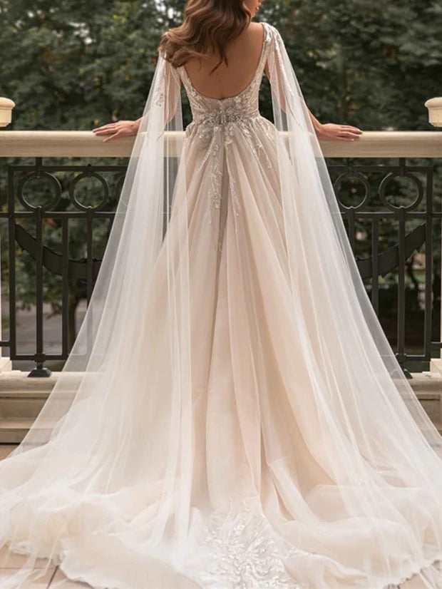 Bride wearing a modern sleeveless A-line wedding gown.