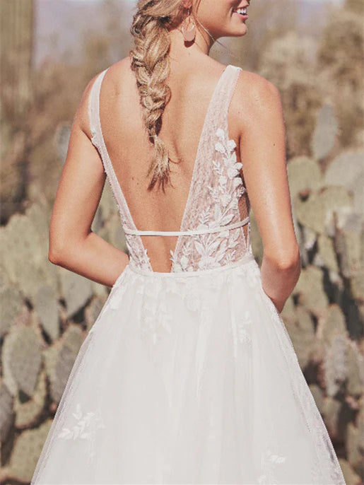 Back view of A-Line wedding dress with a long sweep train.
