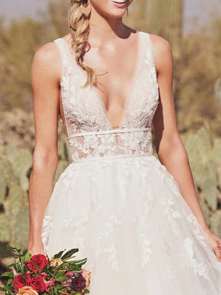 Close-up detail of the sweep train on an A-Line wedding dress.