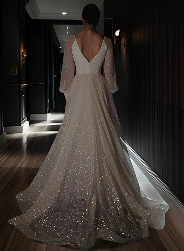Back view of an A-line V-neck wedding dress, showcasing the beautiful train.