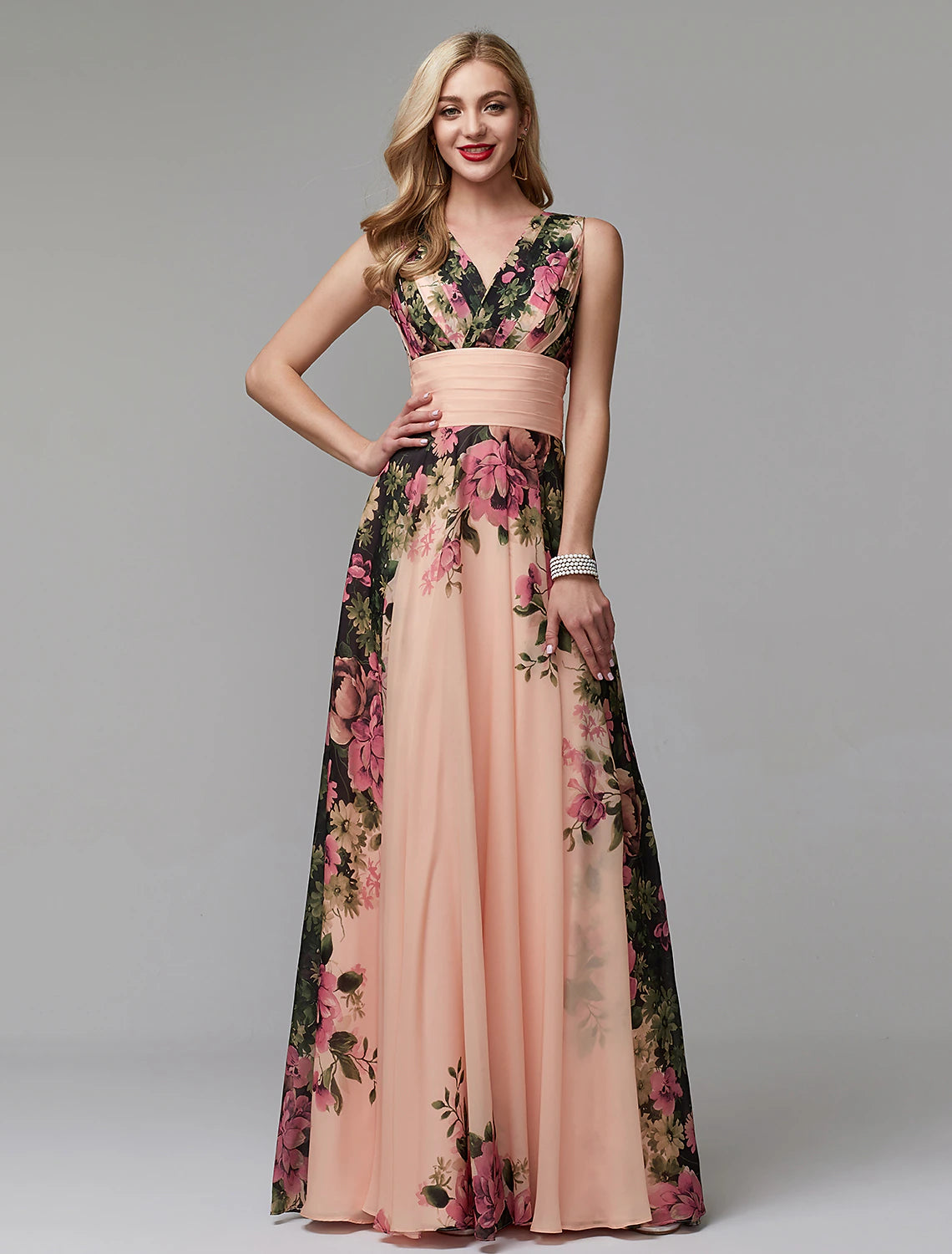 Woman wearing an elegant A-line floral chiffon V-neck floor-length dress, front view.
