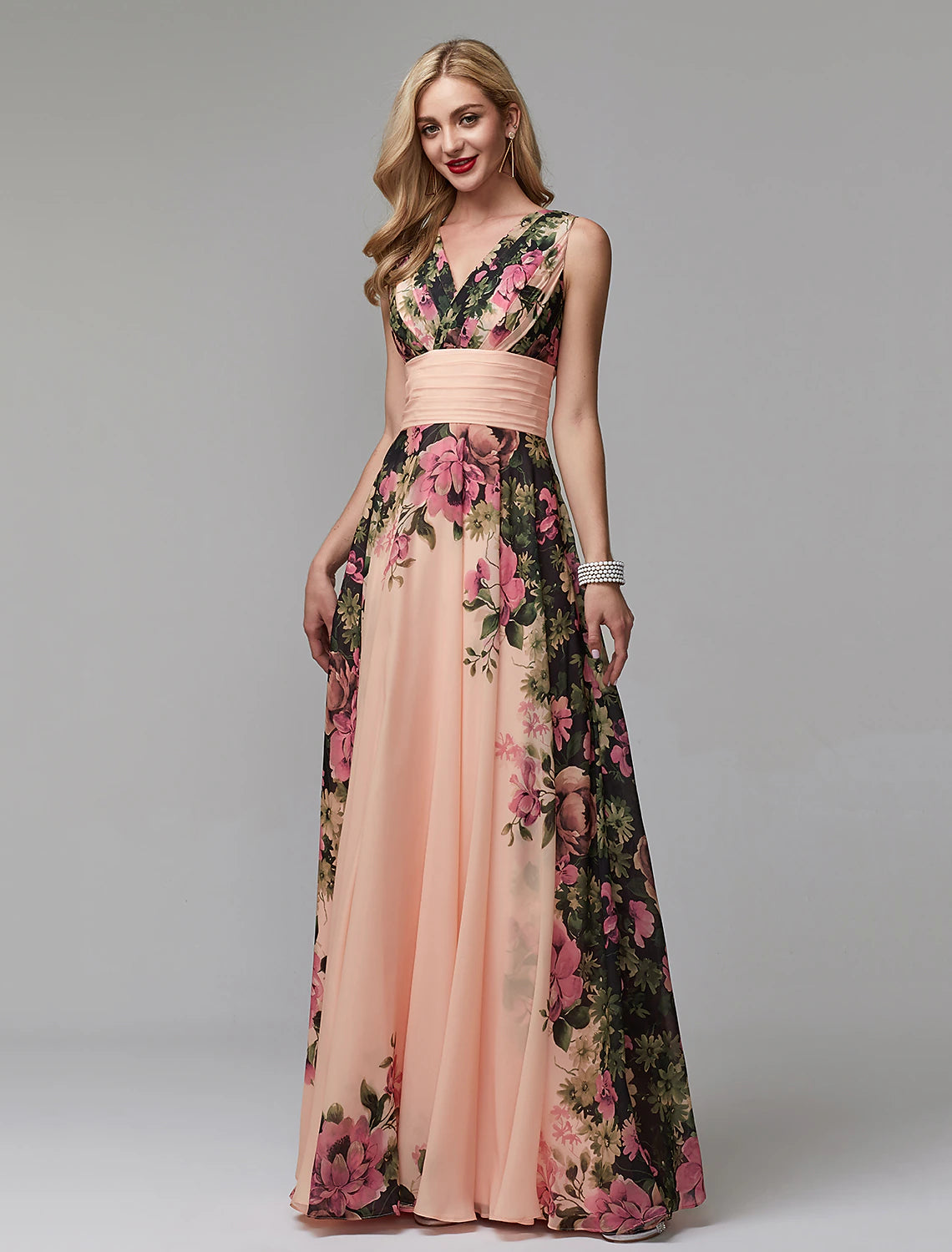 Back view of a woman in an A-line floral chiffon V-neck floor-length dress.