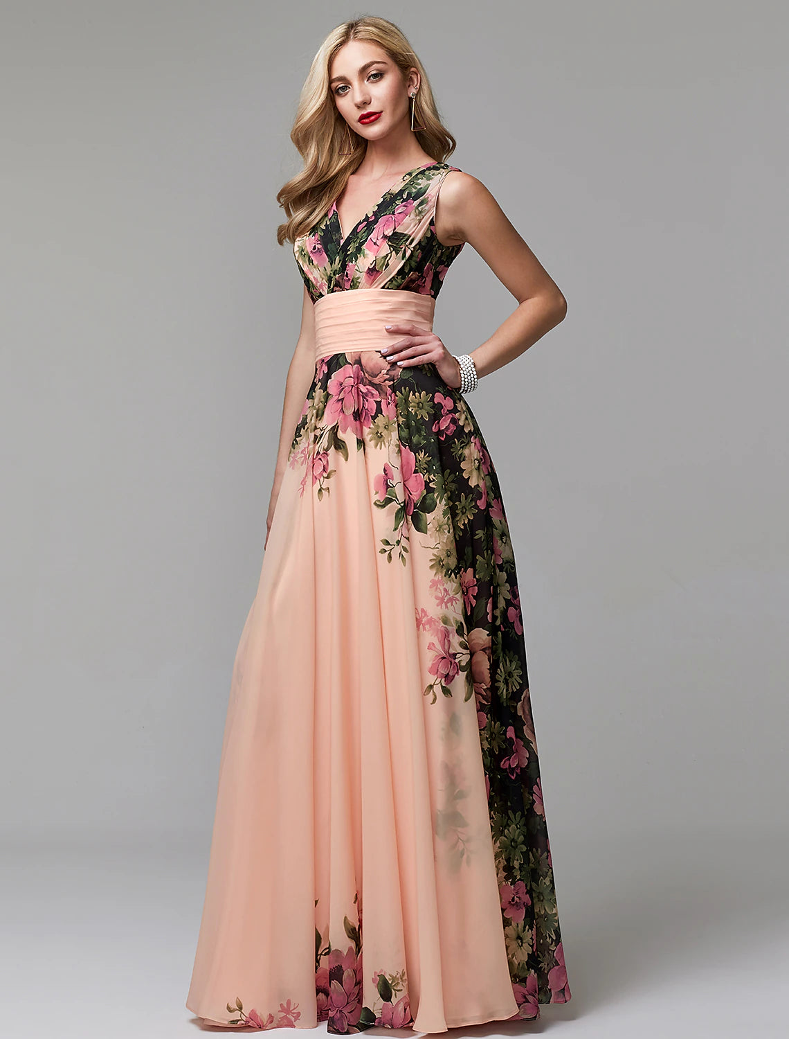 Detail of the V-neckline and sleeveless design of the floral dress.