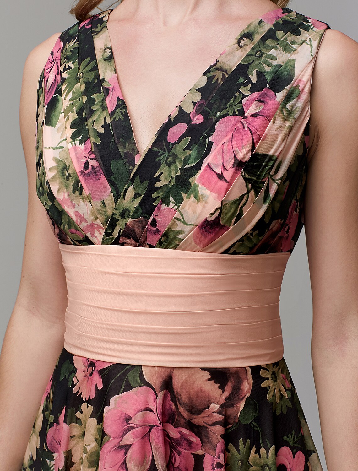 Model showcasing the elegant drape of the floral chiffon party dress.