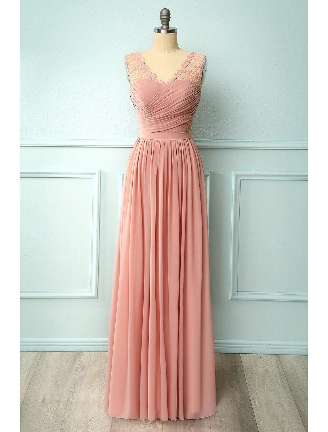 Back view of a floor-length sleeveless A-line dress with floral appliques.
