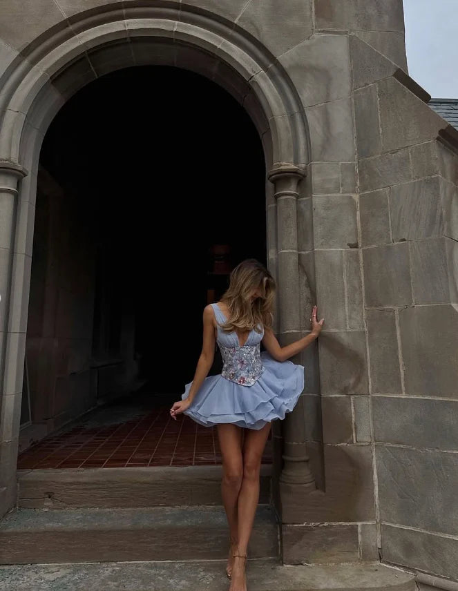 Back view of light blue tiered chiffon formal dress.