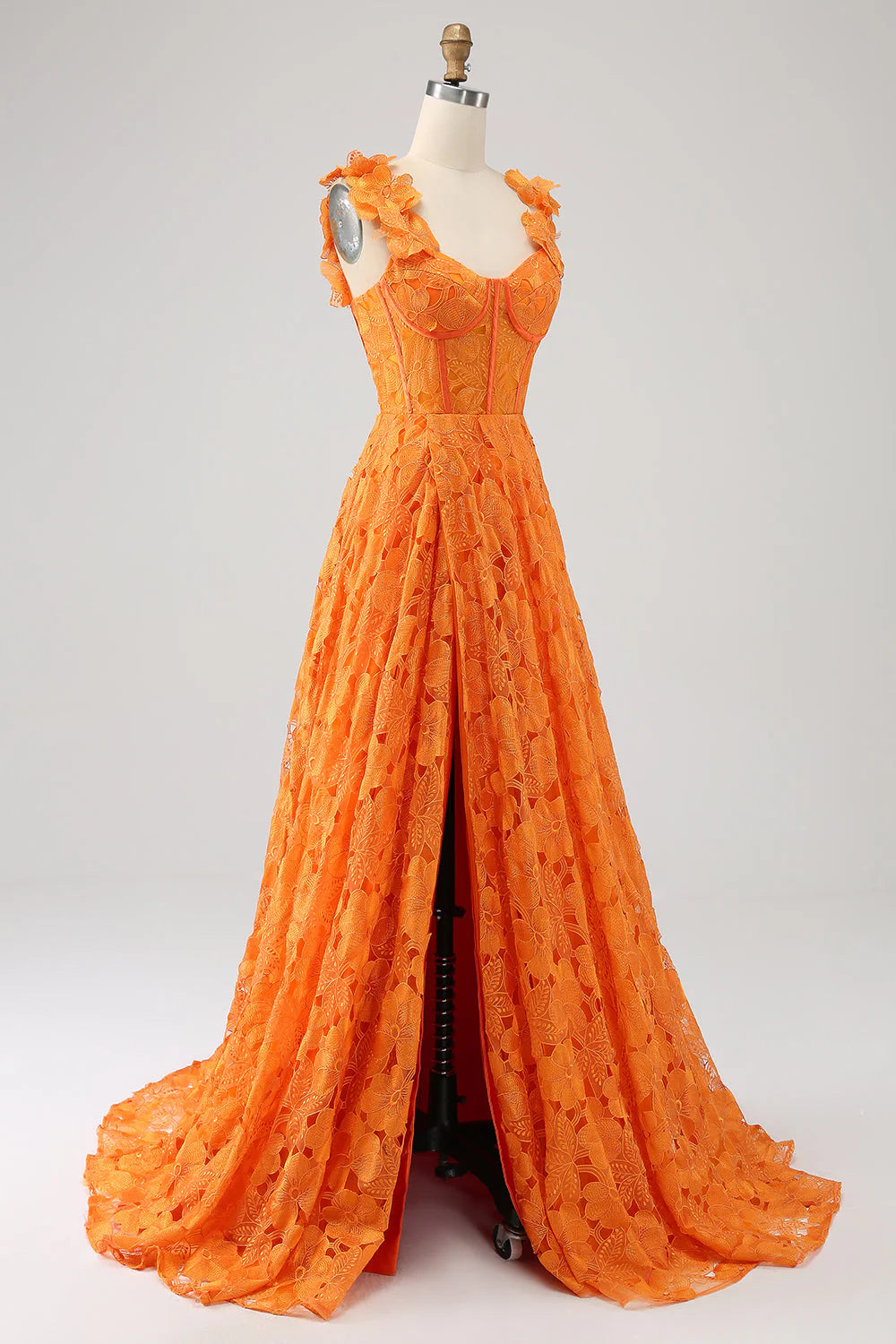 Back view of an orange A-line floral lace long prom dress.