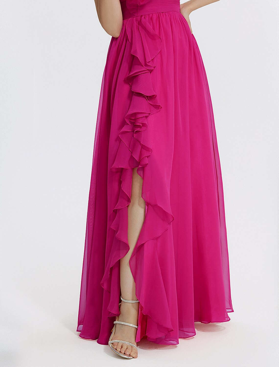 Close-up of ruched appliques on a V-neck formal dress.