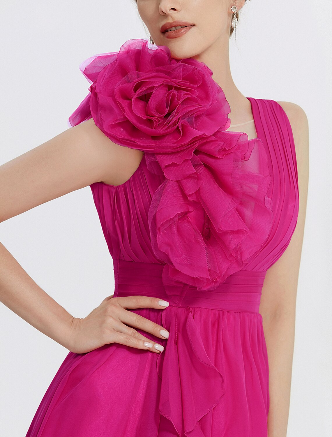 Model posing in a flowing A-line chiffon evening dress.