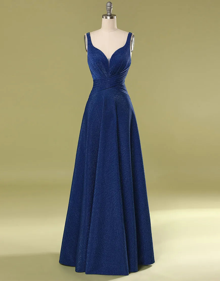Model wearing an elegant A-line V-neck long glitter prom dress with delicate pleating.