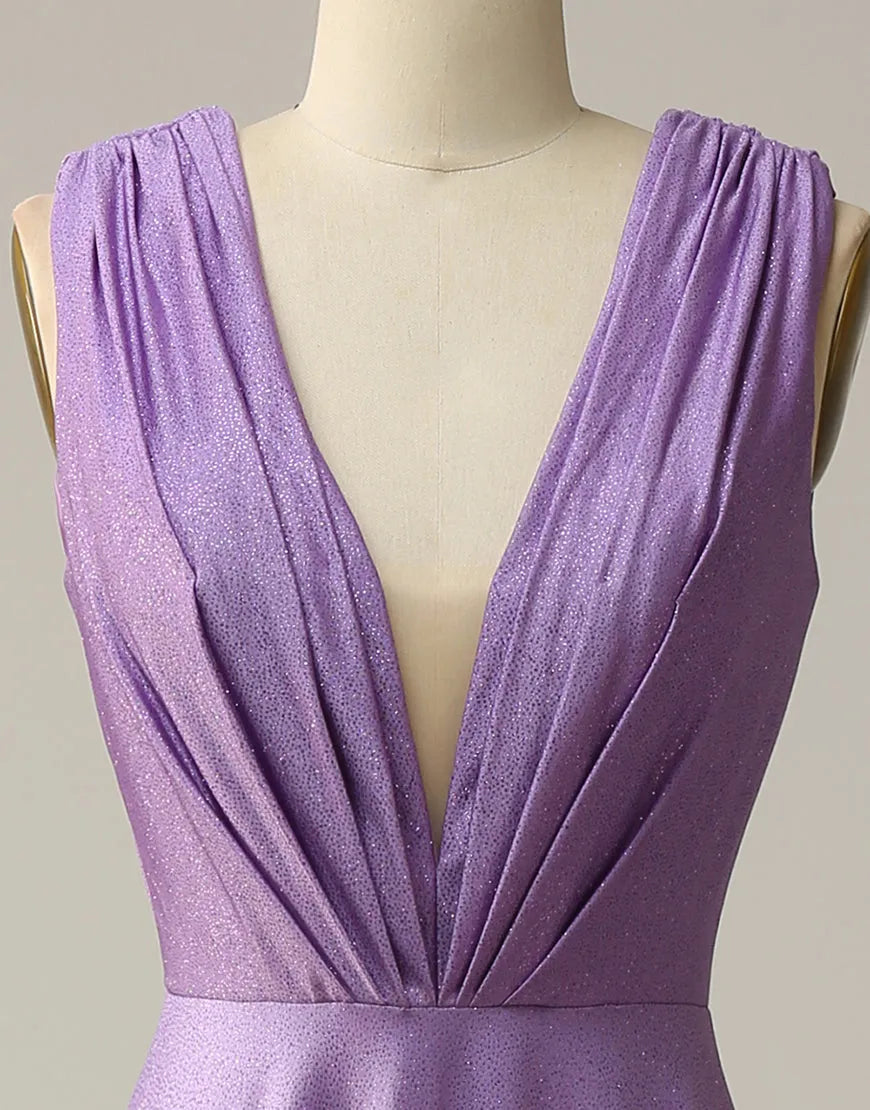 Close-up of the glitter fabric and pleating on a purple prom dress.