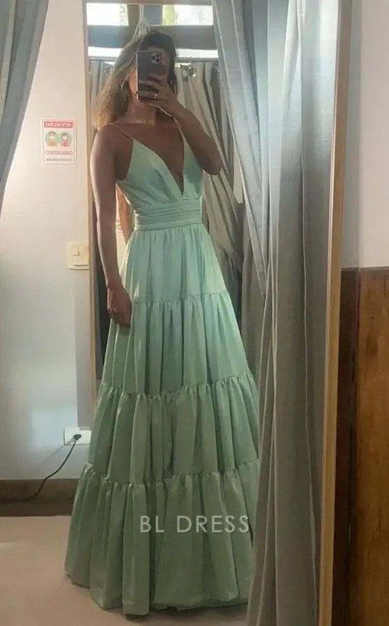 Model wearing an elegant A-line V-neck green satin long formal dress.