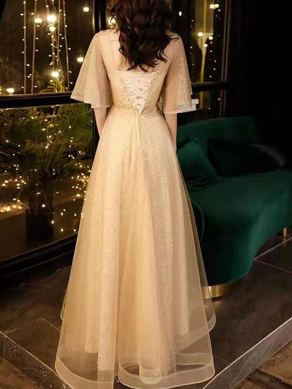 Side view of the A-Line V-Neck Tulle Half Sleeves Beaded Prom Dress, showing the flowing skirt.