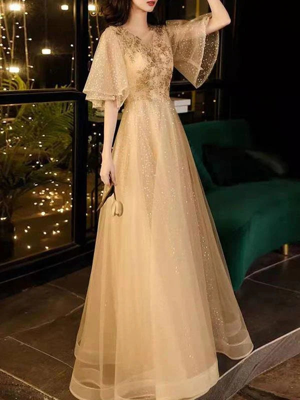 Close-up of the V-neckline and beaded half sleeves on the Tulle Prom Dress.