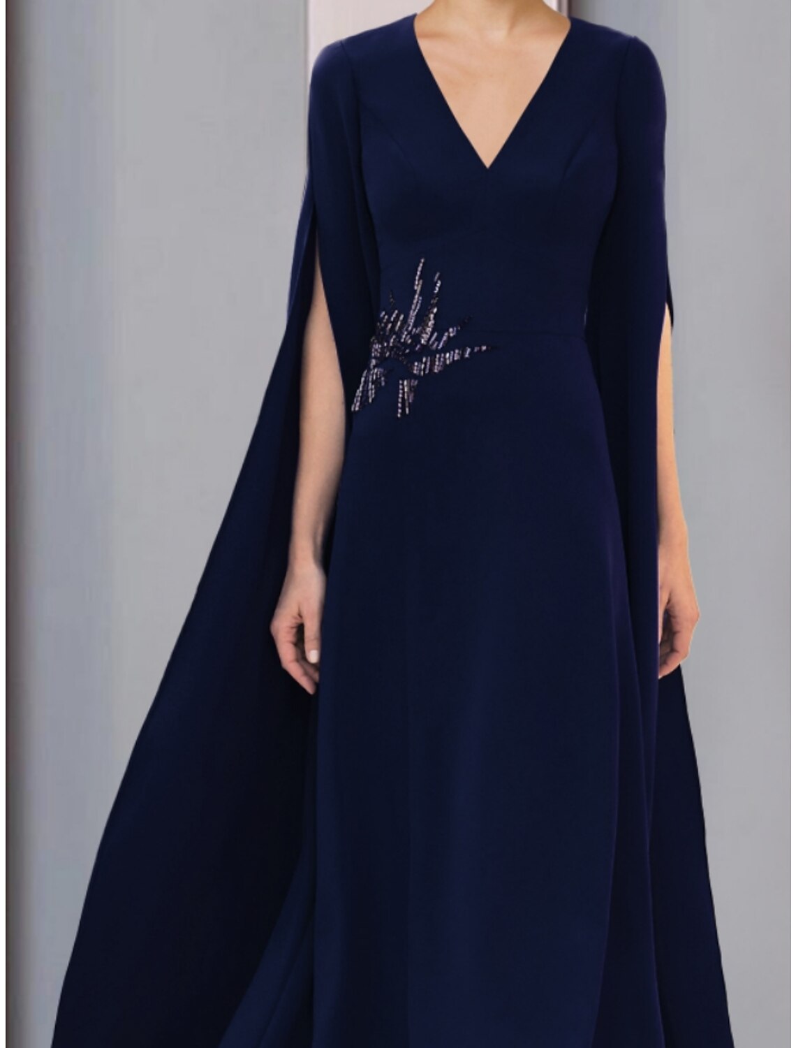 Back view of the ankle-length stretch chiffon gown, suitable for wedding guests.