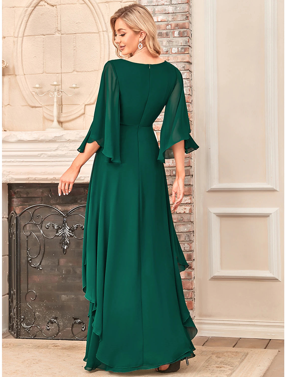Close-up of the V-neckline and half sleeves on the elegant dress.