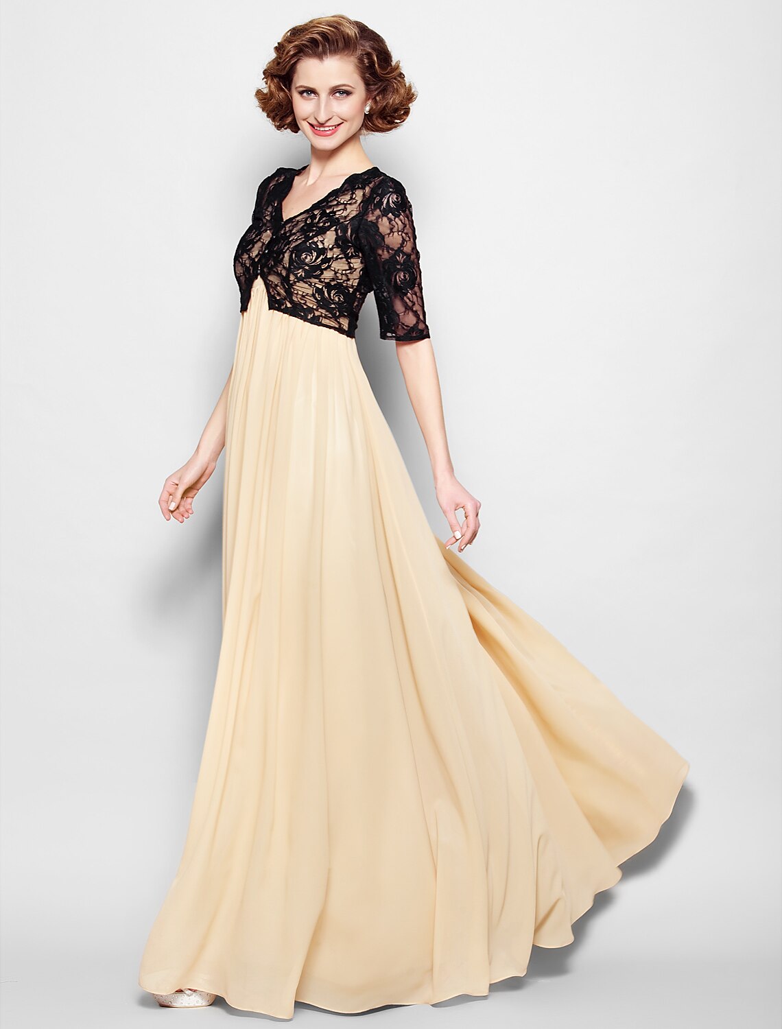 Woman posing gracefully in the A-line chiffon mother of the bride dress.