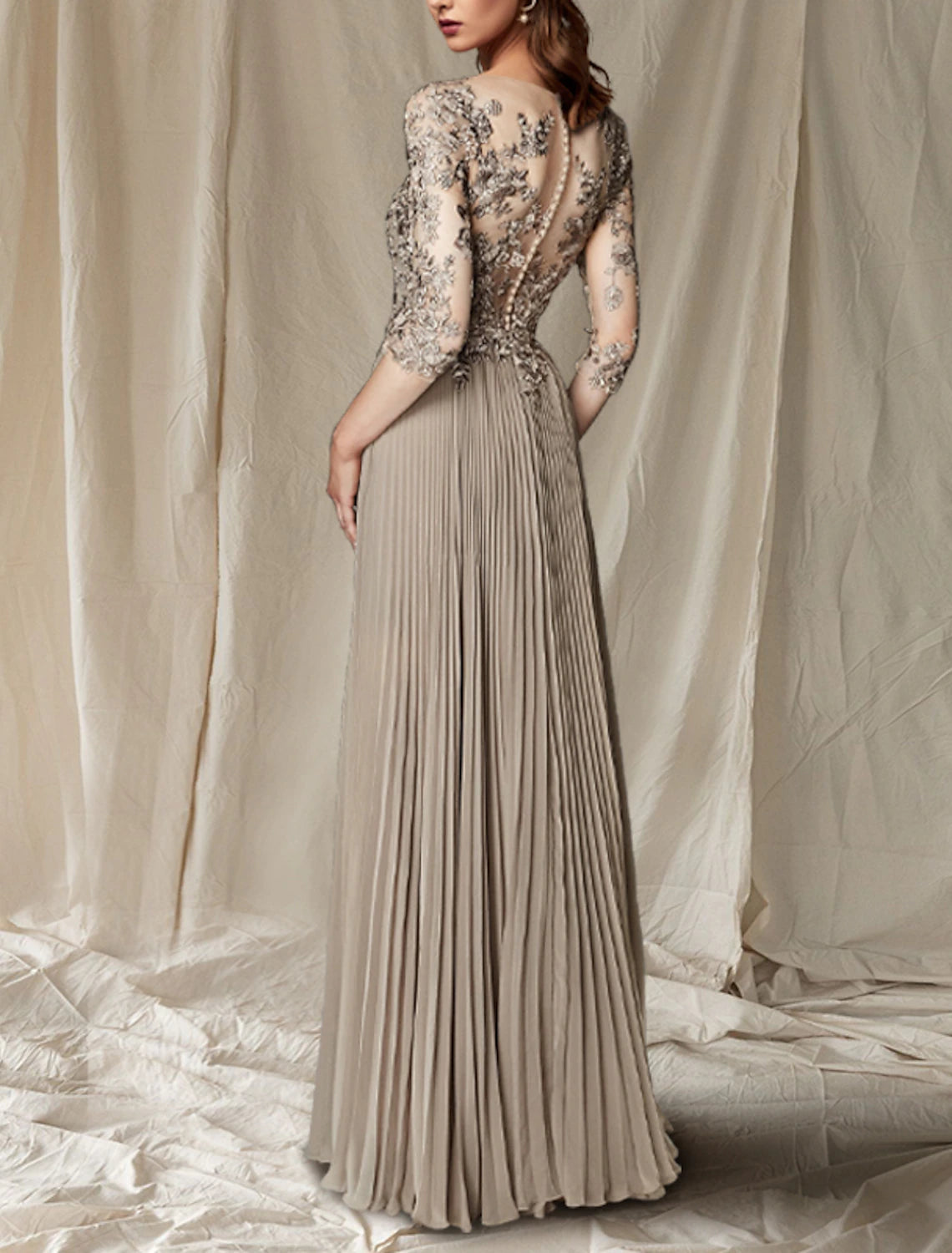 Back view of the elegant half sleeve wedding guest gown.