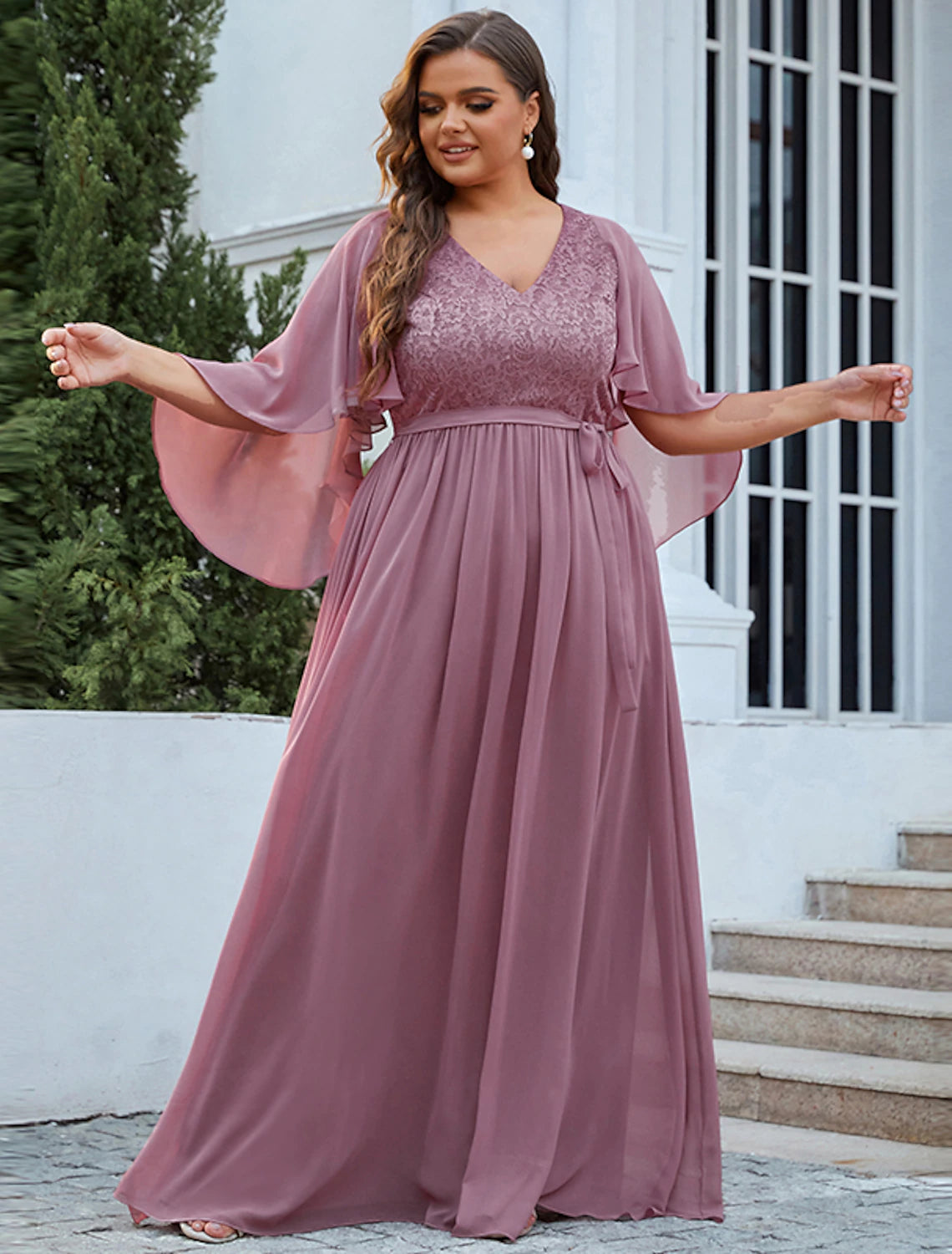 Back view of A-line chiffon Mother of the Bride gown with sash.
