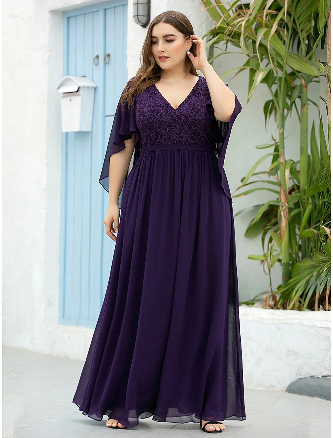 Model showcasing the flowing chiffon skirt of the A-line dress.