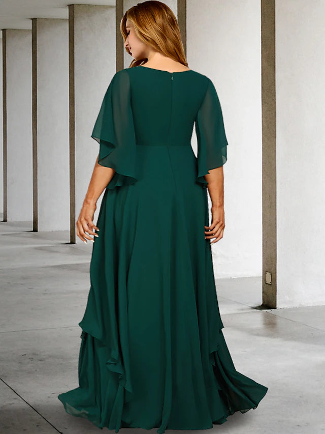Side view of an elegant A-line plus size mother of the bride dress showing ruffled details.