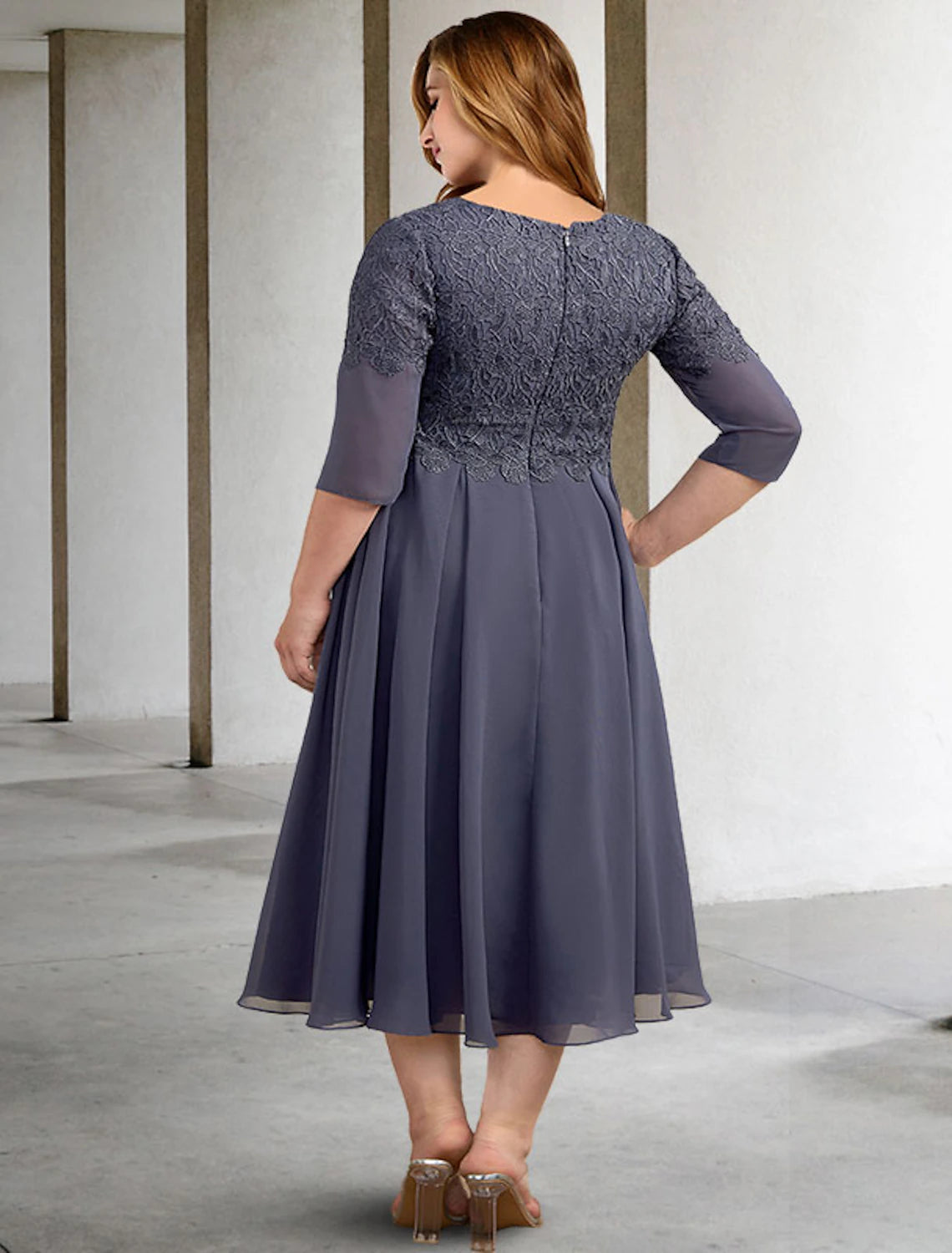 Side view of an elegant A-line V-neck half sleeve chiffon tea length Mother of the Bride dress.