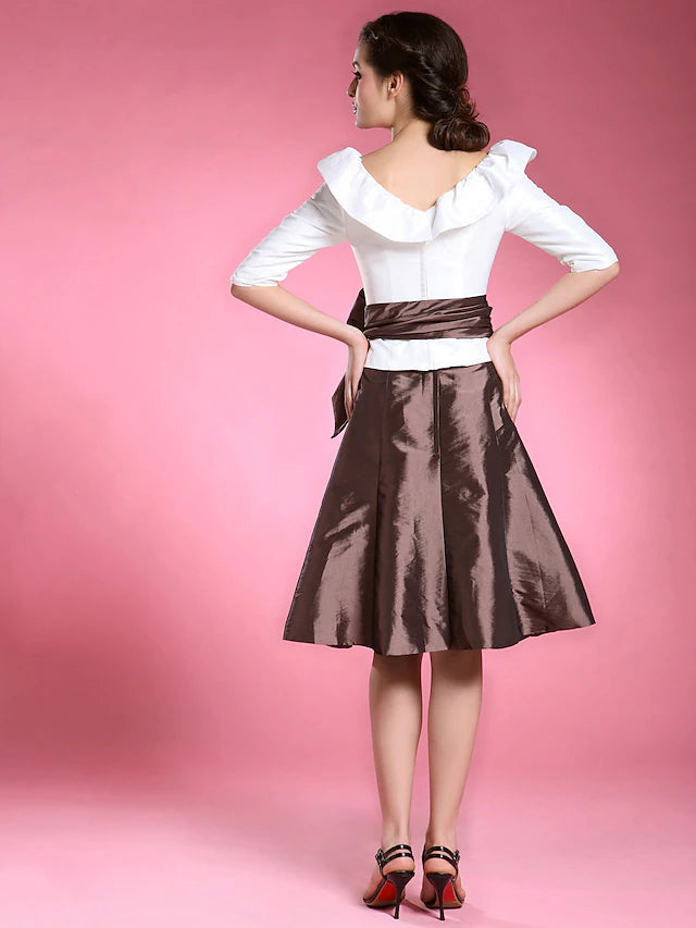 Back view of the A-line Mother of the Bride dress, showing the knee-length hem.