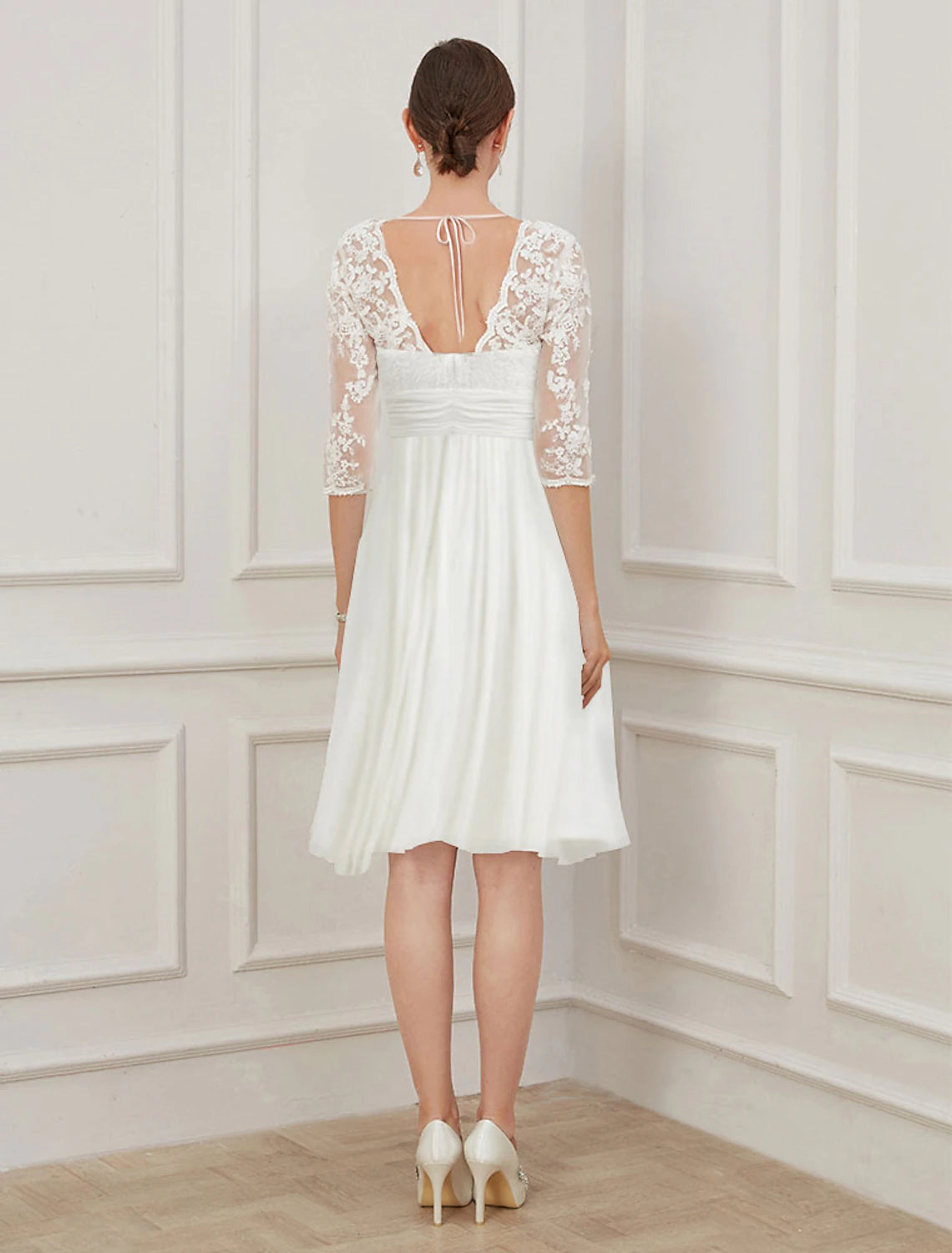 Full view of the white chiffon A-line dress, perfect for special occasions.