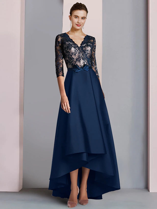 Woman wearing an elegant A-line V-neck half sleeve high-low tea length dress.
