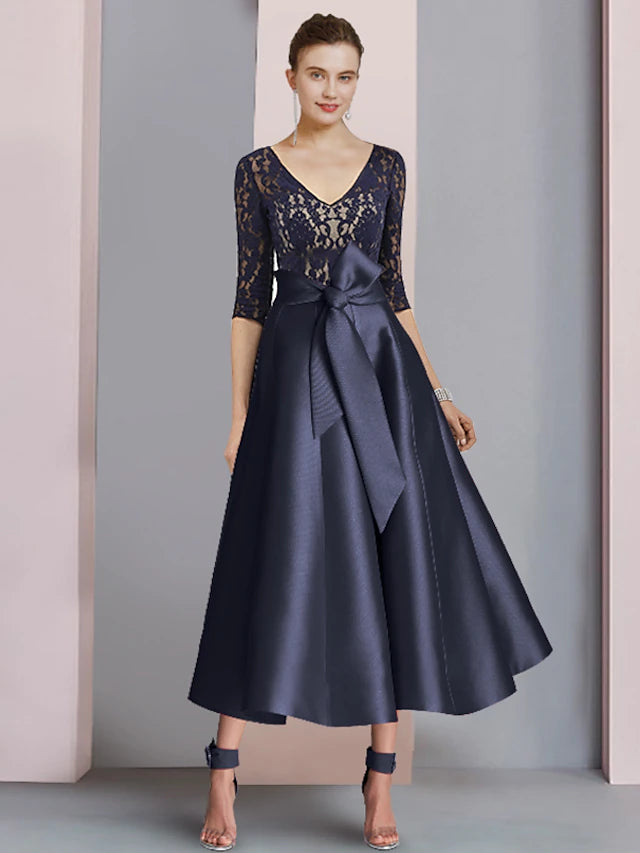 Elegant A-Line Mother of the Bride dress with V-neck, half sleeves, lace, and pleats.