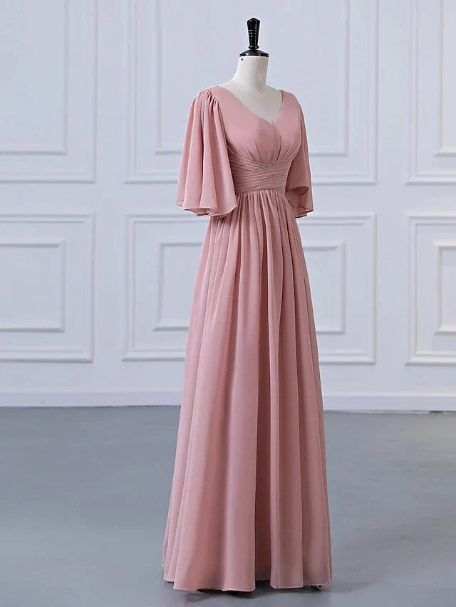Detail of the pleated and ruffled skirt of an A-line chiffon dress.