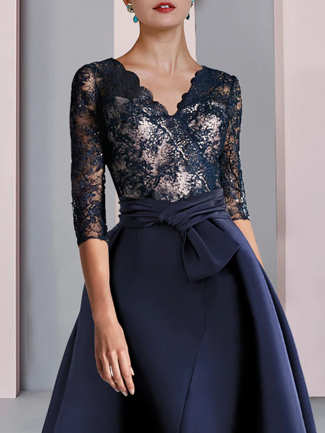 Close-up of the V-neckline and half sleeves on the formal gown.