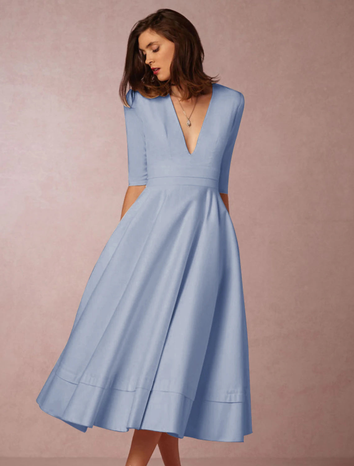 Back view of the pleated A-Line dress in white.