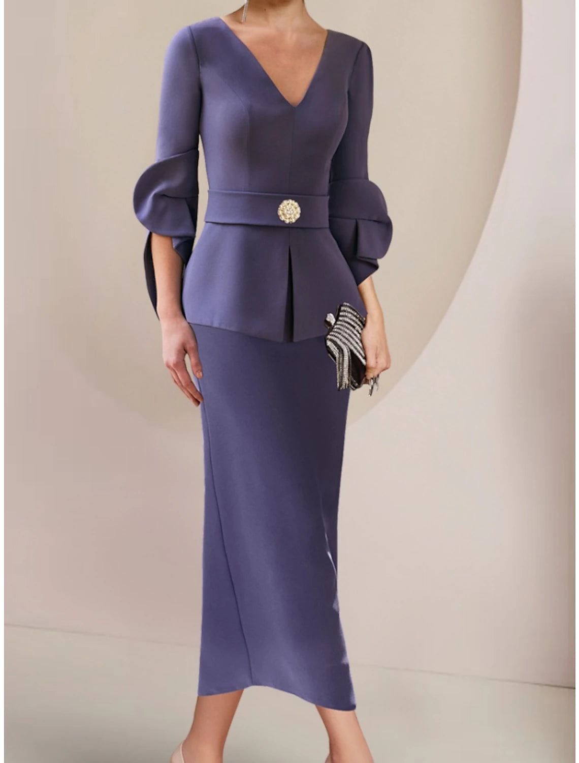 Back view of the A-Line wedding guest dress, showing ankle length and ruched details.