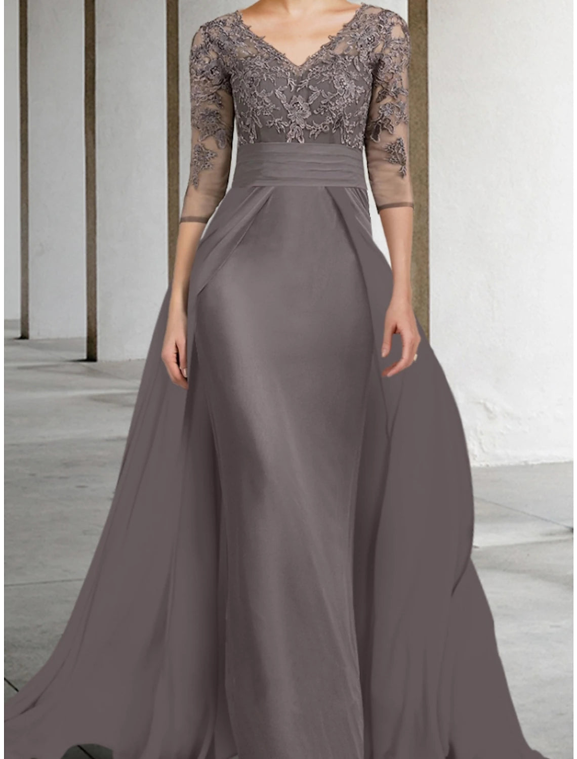 Floor-length chiffon lace gown featuring ruching, suitable for wedding guests.