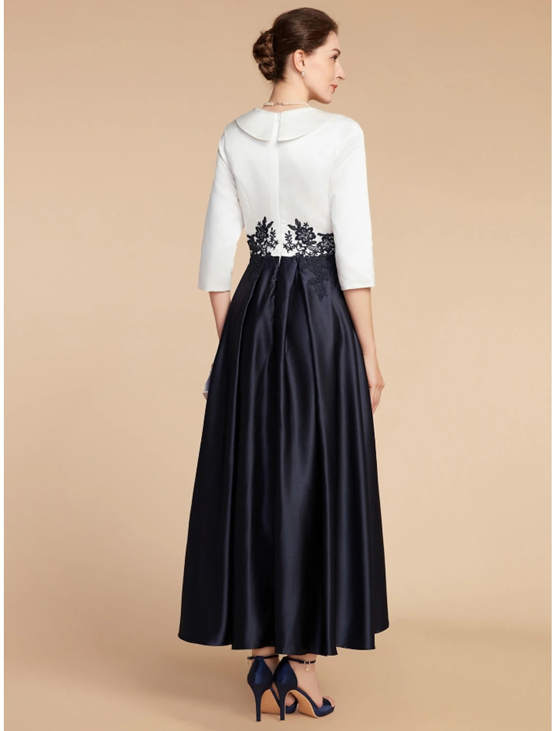 Side view of A-line satin lace dress showing asymmetrical ruching.