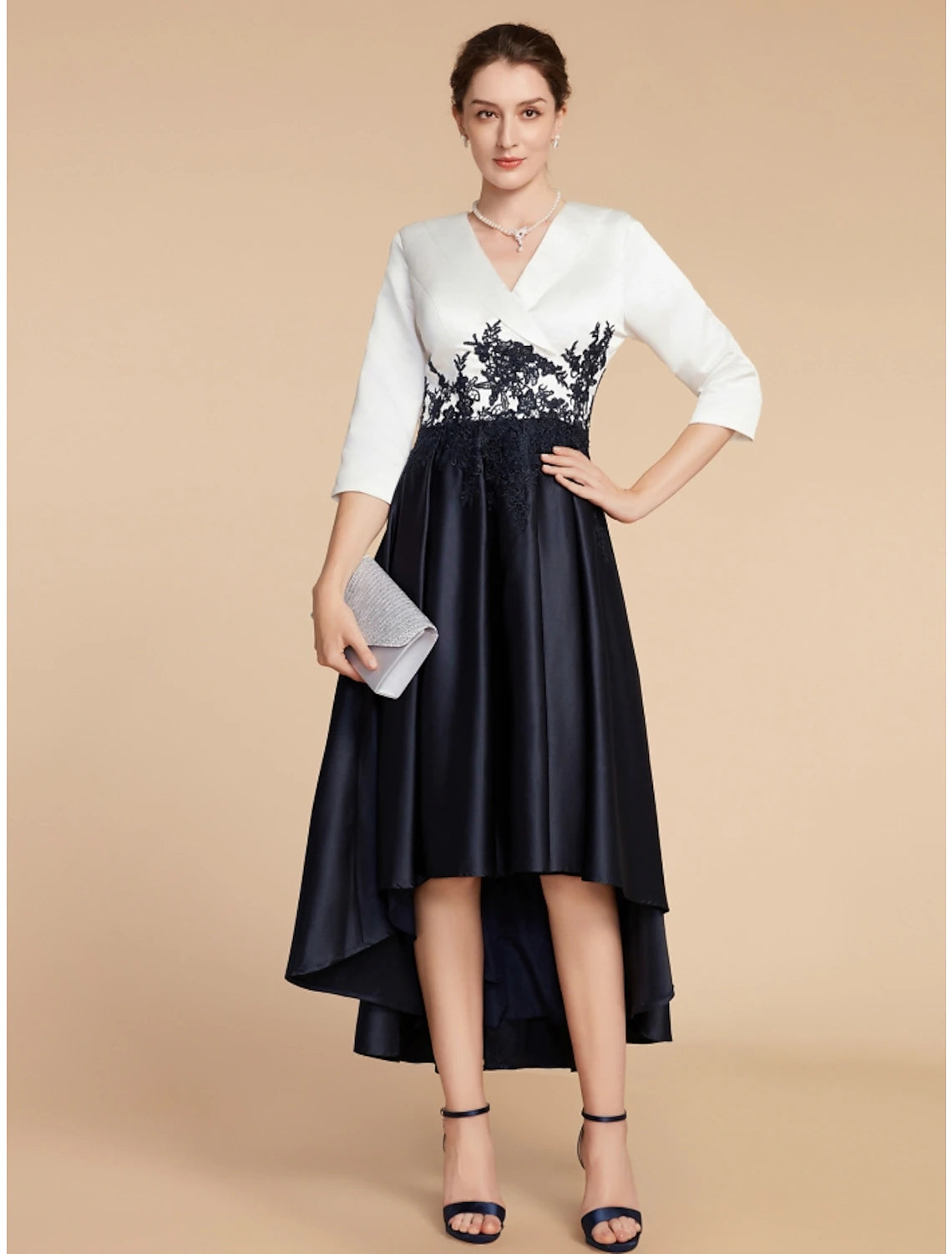 Close-up of V-neckline and lace half sleeves on satin dress.