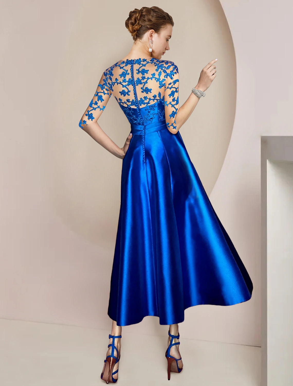 Close-up of the elegant A-Line dress showing V-neck, half sleeves, and delicate lace details.
