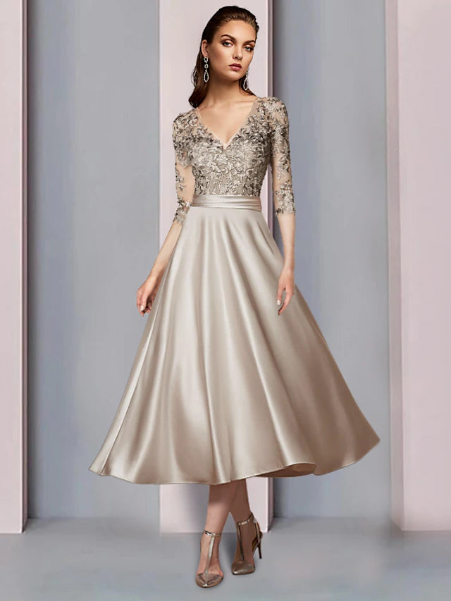 Elegant A-Line V-neck half sleeve satin lace tea length dress with pleats and appliques.