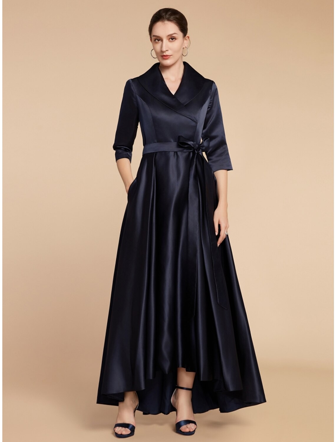 Detail of the sash/ribbon and ruching on the A-line satin dress.