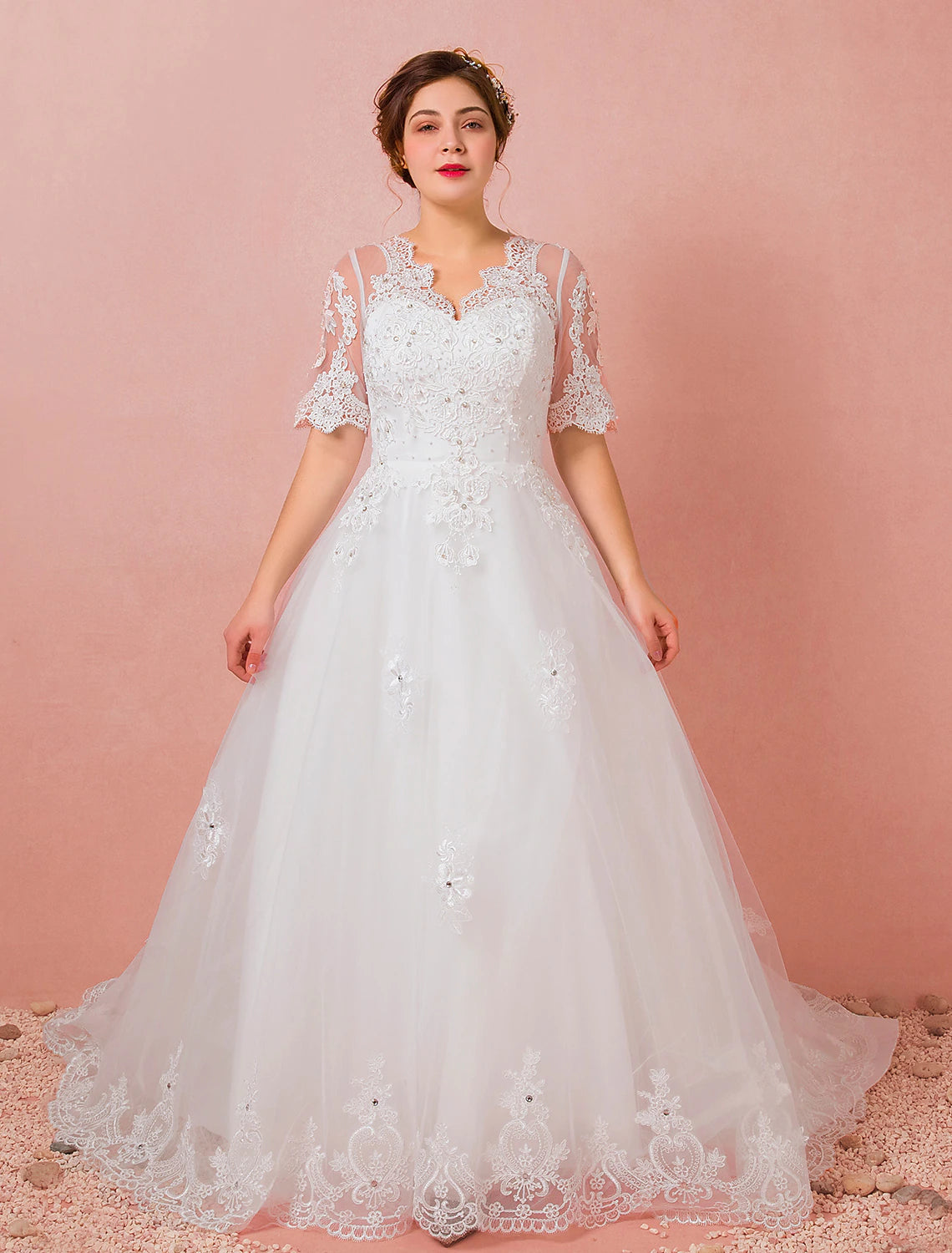 Side profile of the bride in the A-line satin wedding gown, highlighting the silhouette.