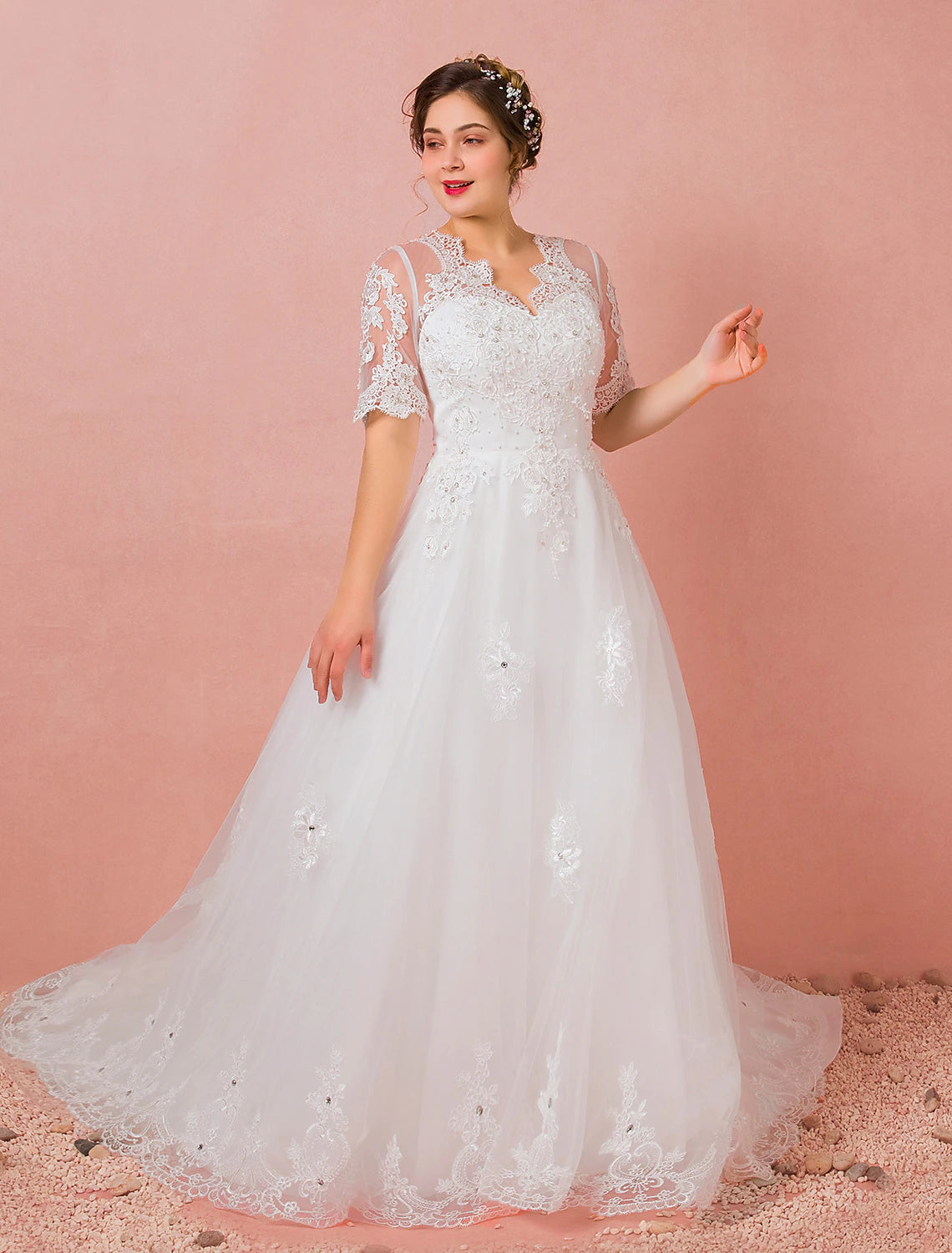 Detailed view of the lace and crystal work on the bodice of the bridal dress.
