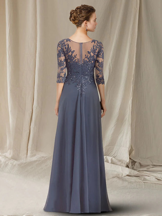 Detailed view of the floor-length chiffon skirt and elegant drape of the A-line mother of the bride dress.