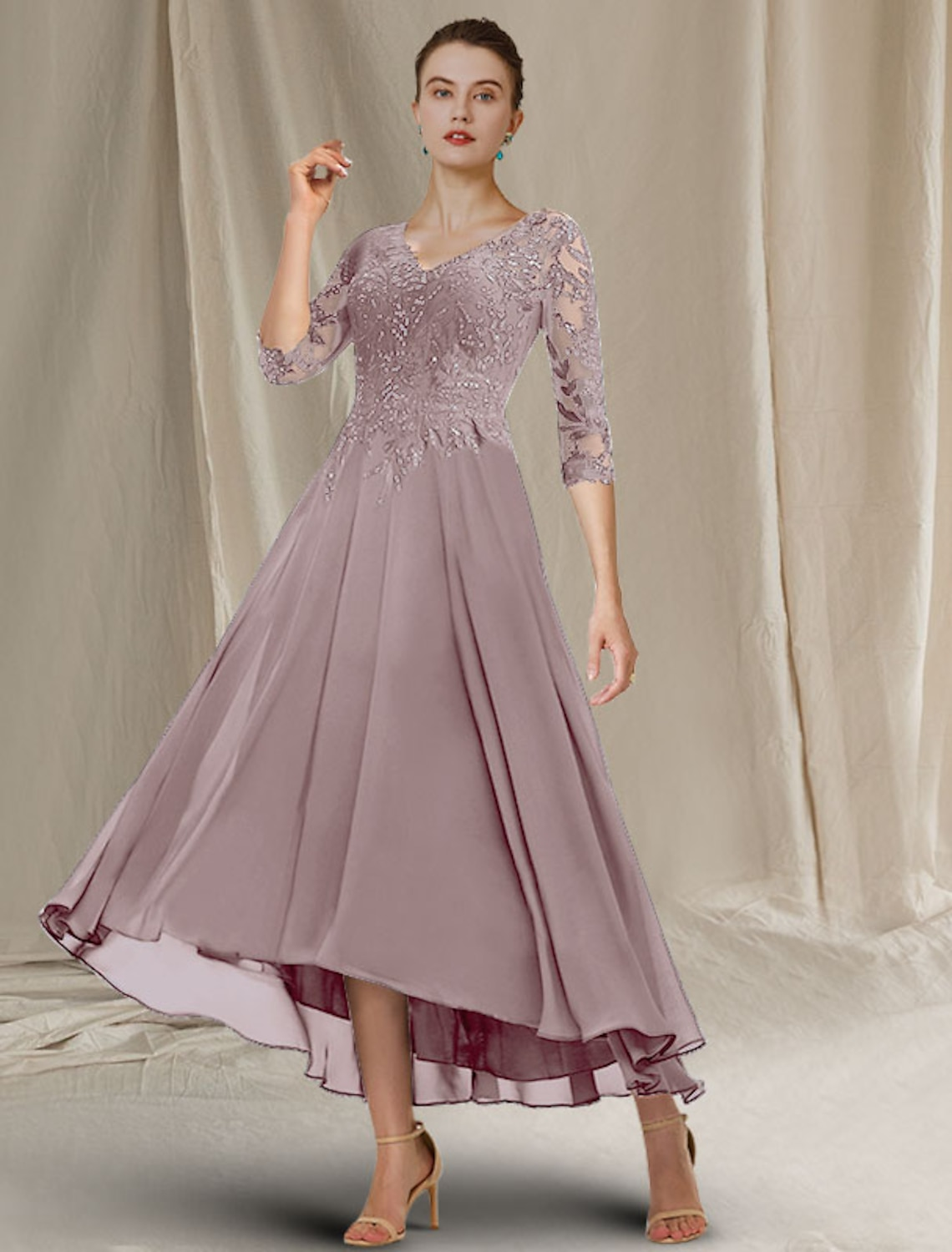 Close-up of the sequin and lace appliques on the dress sleeve.