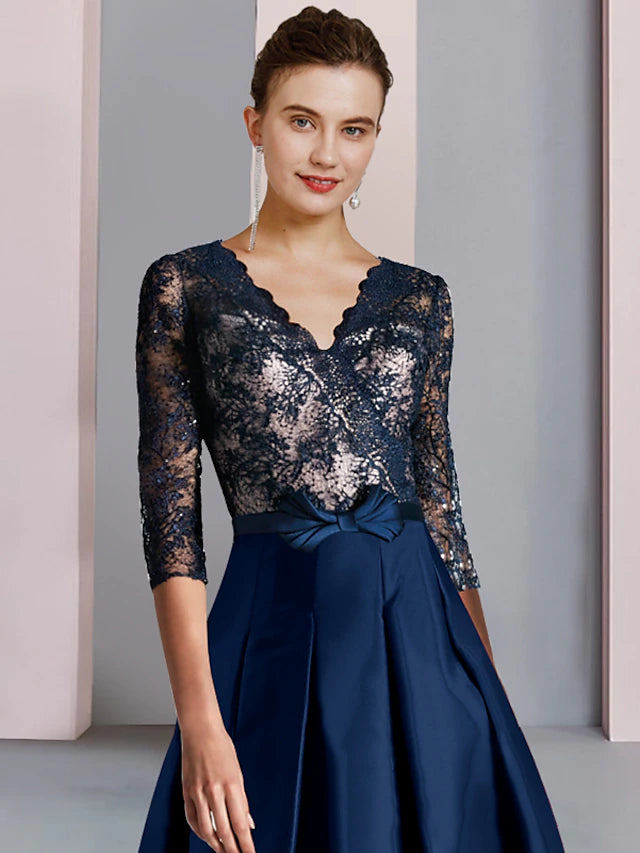 Side view of the tea length satin lace Mother of the Bride dress.